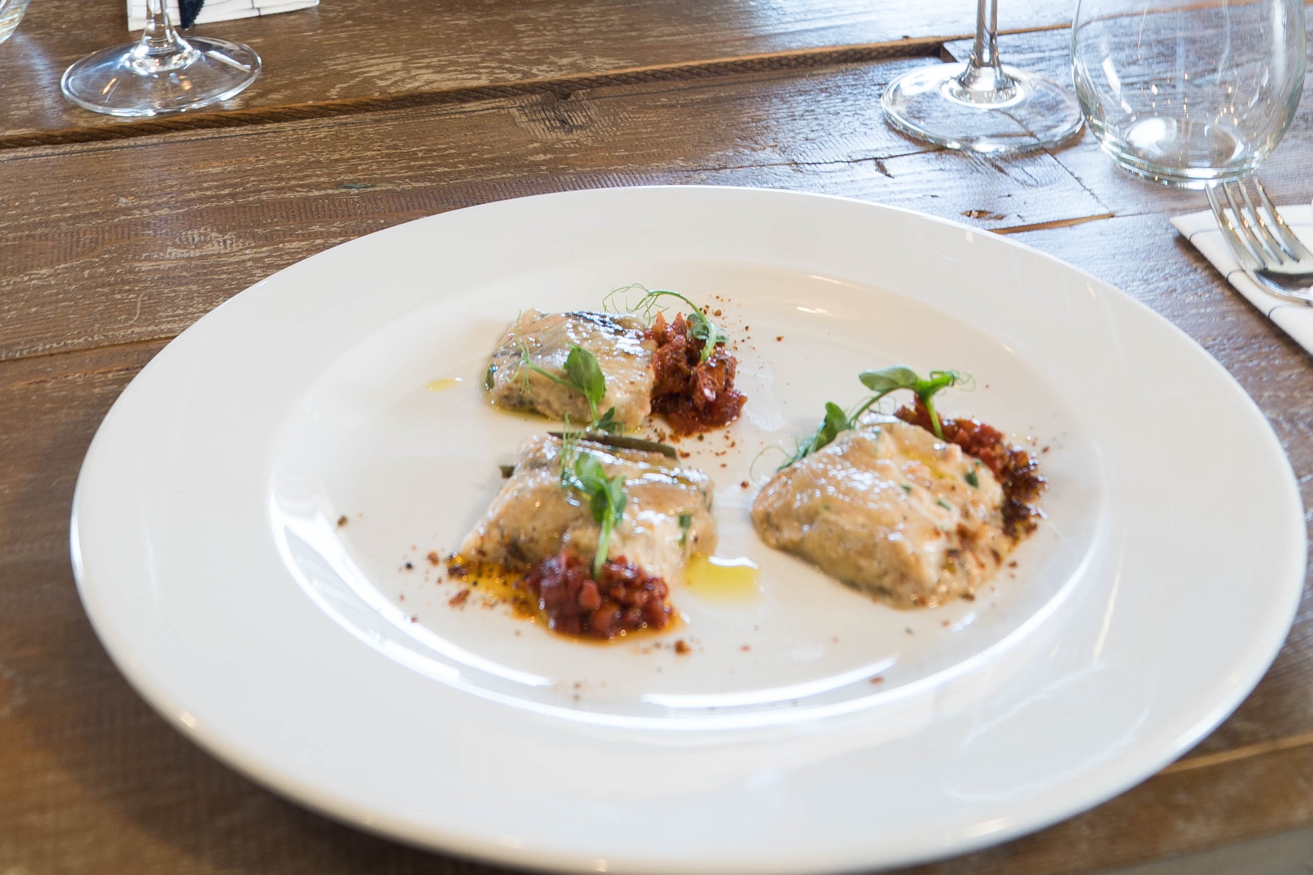 A plate of food on a wooden table.